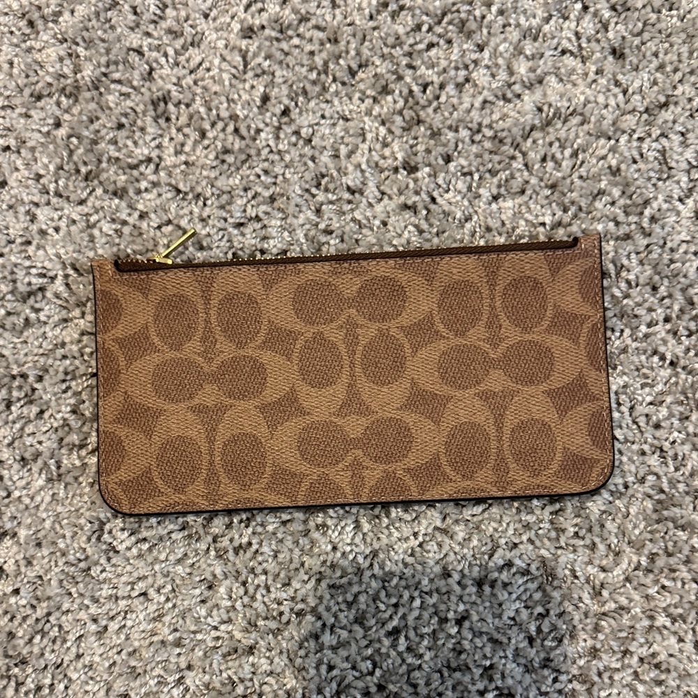 Brown Patterned coach brand new Clutch